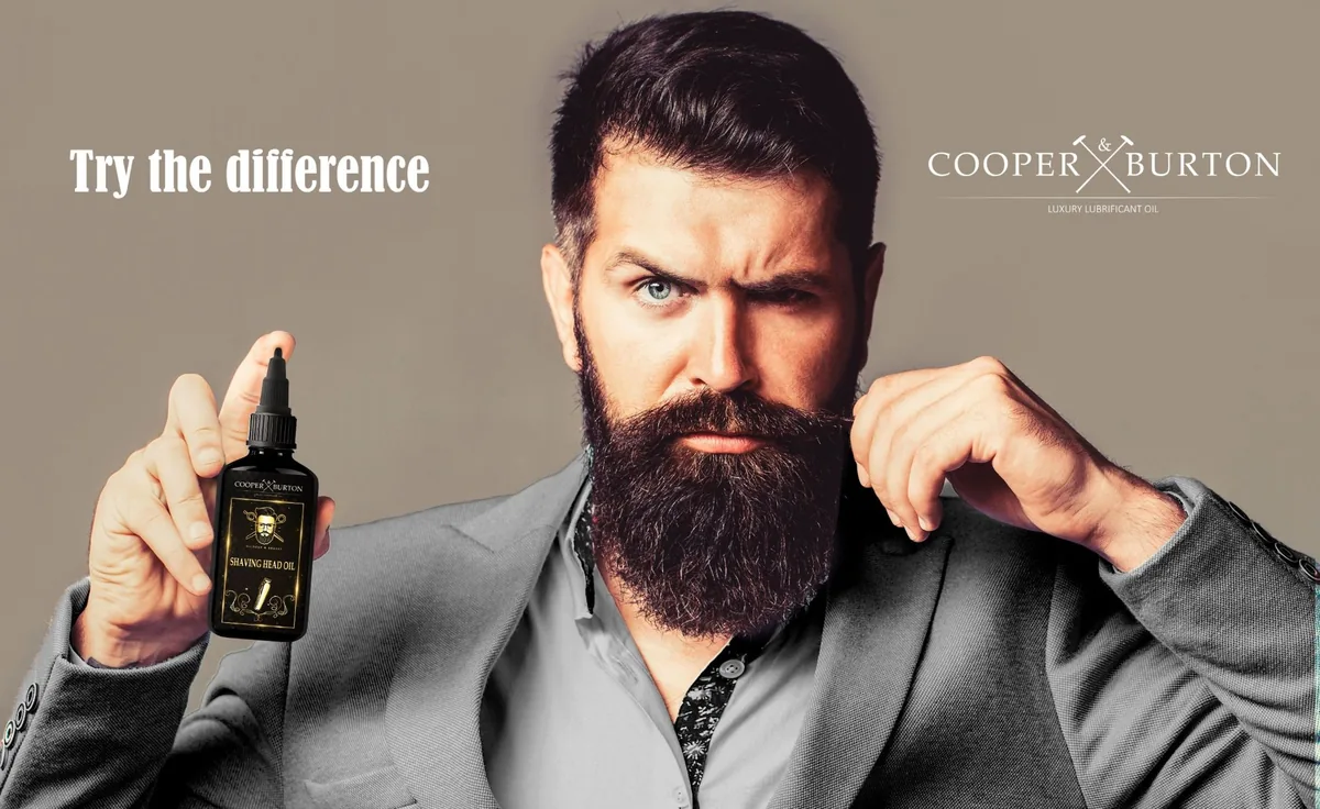 Bärtiger Herr mit Shaving Head Oil von Cooper & Burton – „Try the difference“
